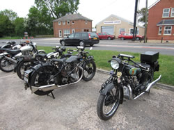 The three vintage bikes cooling down at the café.